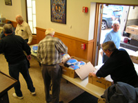Retirees Setting Up Boxes of Frozen Turkeys