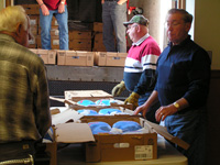 Retirees Opening Frozen Turkey Boxes